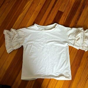 Ruffle sleeved jersey top with pearl embellishments